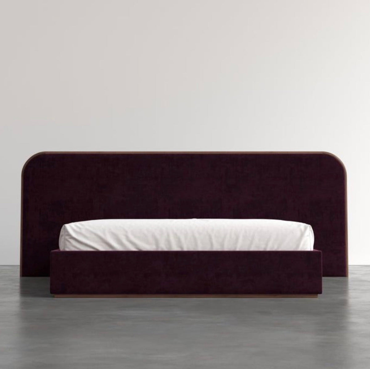 Wide curved headboard bed in plum velvet, made to a bespoke width