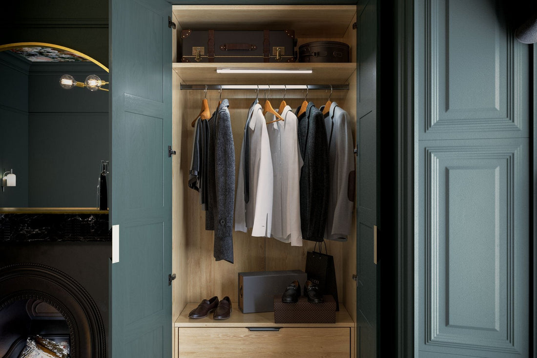 Deep green beaded Shaker wardrobe with the doors open and lit interior