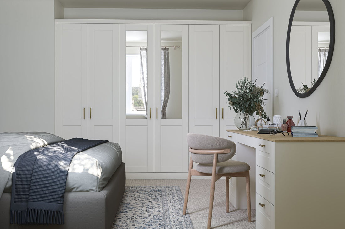 Smooth porcelain Shaker fitted wardrobes with a dressing table and round mirror