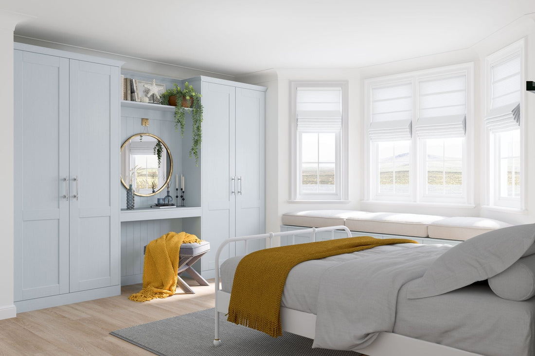 Pale blue textured-grain Shaker wardrobes with a mirror alcove