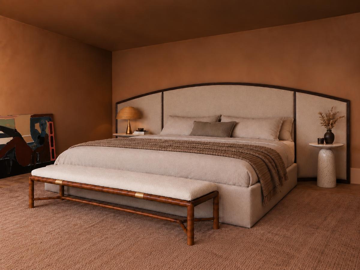 The Arco upholstered bed with extended headboard by Yorkshire Interiors — shallow arched headboard in a slim dark timber frame, extending symmetrically beyond the bed base