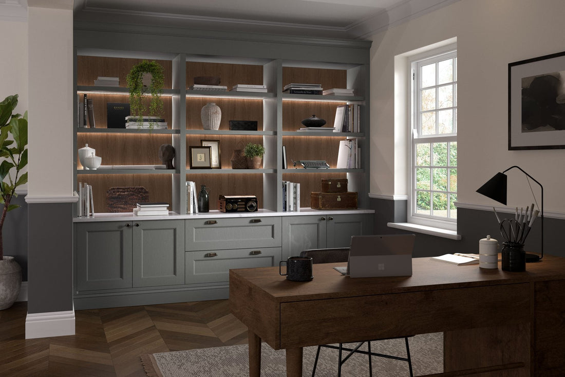 Fitted study in grey-green Shaker with lit shelving and a walnut desk