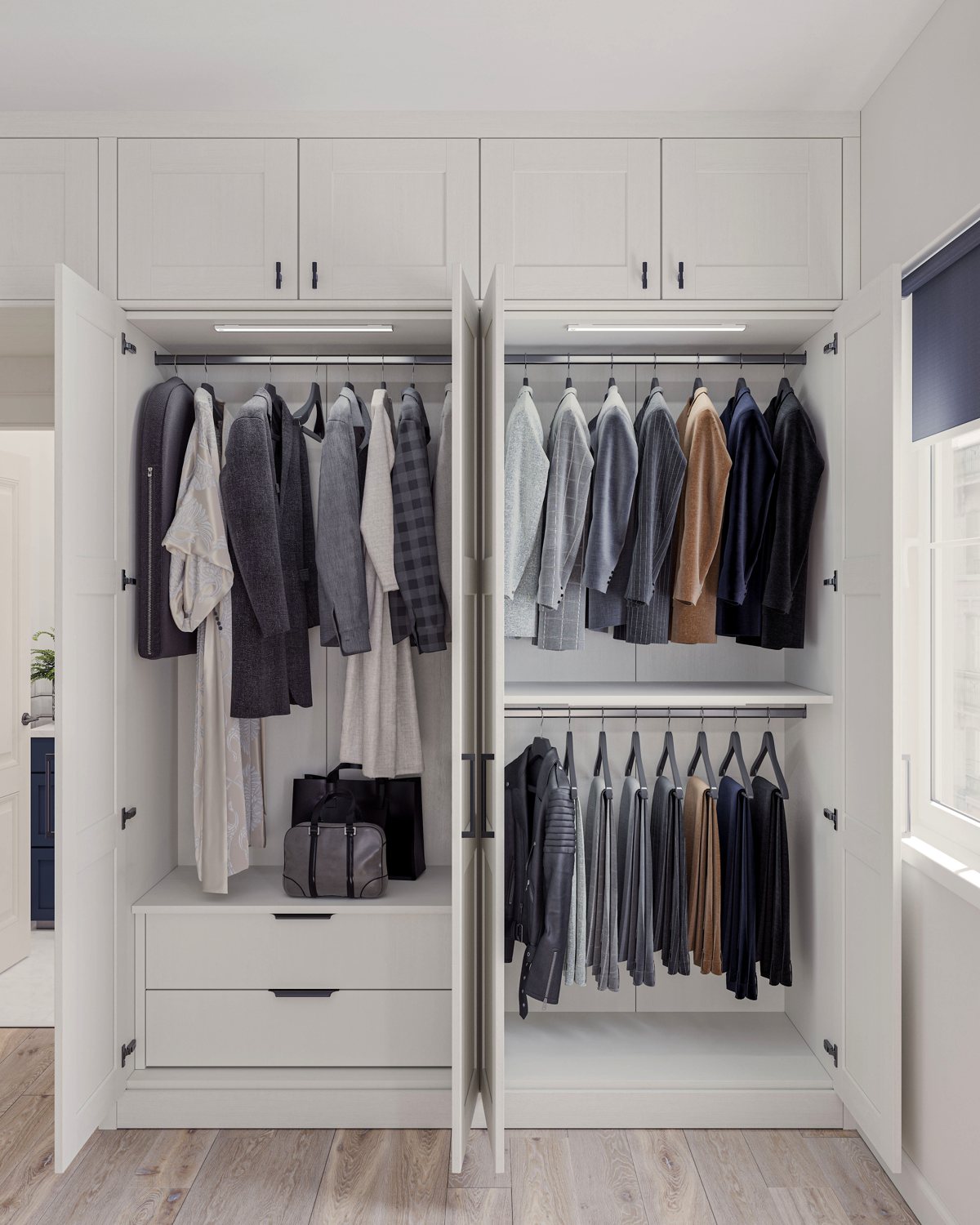 Open fitted wardrobe with lit double hanging and drawers