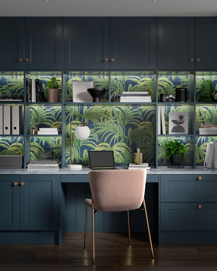 Fitted home office in deep blue with lit shelving